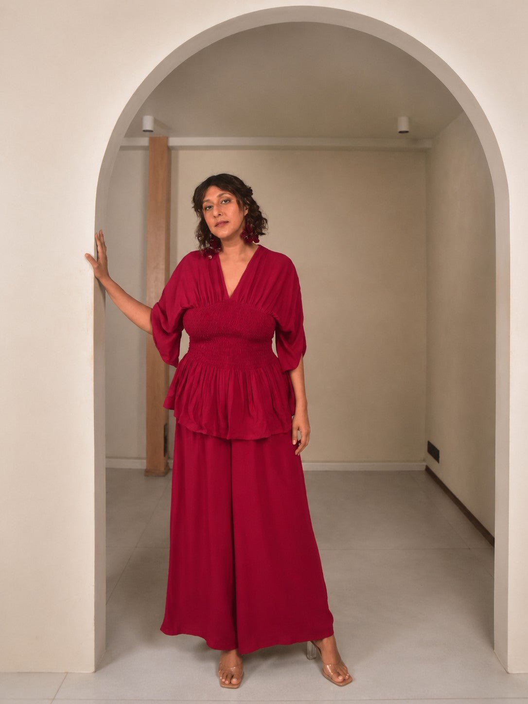 a full body photograph in a neutral indoor space 150kb